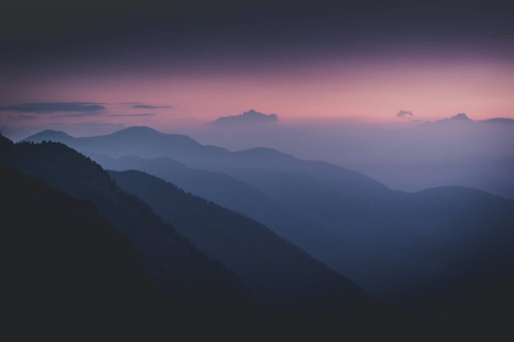 silhouette of mountains during dawn